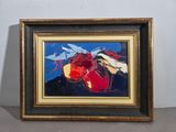 tableau encadré représentant une fleur rouge et jaune sur fond bleu