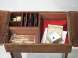 a wooden table with a bunch of items in it
