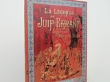 un vieux livre sur lequel figure l'image d'un homme et d'un cheval