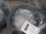 several different types of cables are wrapped in plastic bags on the floor