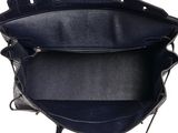 a close up of a black purse with a zipper on it