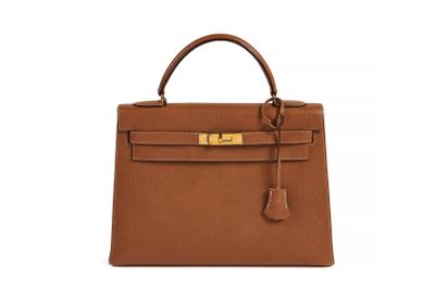 a brown leather handbag on a white background
