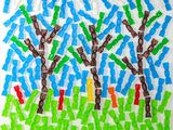 a close up of a piece of paper with a picture of trees on it