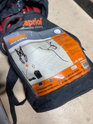 a bag that is sitting on the floor next to a suitcase