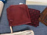 several pieces of cloth are laid out on a table