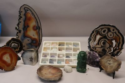 many different types of rocks and stones on the table