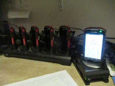 a cell phone that is sitting on a charging station