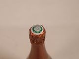 a close up of a bottle of beer on a table