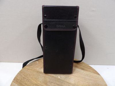 a cell phone case sitting on top of a wooden stand