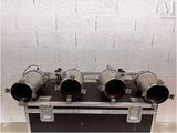 a black case that has three exhaust pipes on top of it