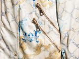 a close up of a jacket with a zipper on it