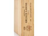 a wooden box with a bottle of wine in it on a white background