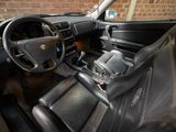 a car dashboard with a steering wheel and a dash board