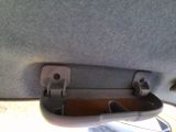 a close up of a car door handle with a phone in it