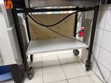 an image of a kitchen with a stove and a shelf