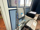 a ladder that is leaning against a wall in a room