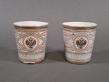 two cups that are sitting next to each other on a table