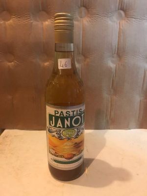 a bottle of wine sitting on a table