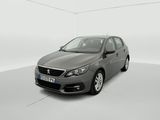 the grey car is parked in a white room with a white floor