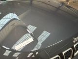 a car that has a sticker on the hood of it