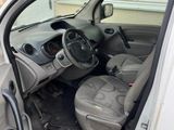 the interior of a car with the door open and the driver ' s seat down