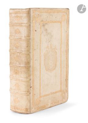 an old book sitting on top of a white surface