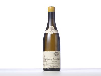a bottle of white wine sitting on top of a table