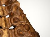 an image of a wooden sculpture of a ship on a body of water