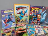 a lot of comic books sitting on a table