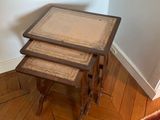 three tables that are sitting on a rug in a room