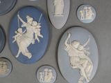 a lot of blue and white cameos on a table