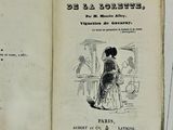 un livre ouvert sur lequel figure l'image d'une femme en robe