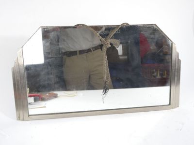 a man standing in front of a mirror holding an umbrella