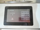 a close up of a microwave with a button on it