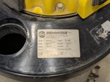 a picture of a yellow and black machine with a label on it