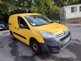 a yellow van that is parked on the side of the road