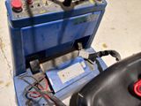 an image of a car battery in a blue box