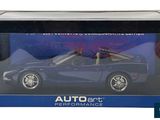 the box is open to show the model car in it ' s packaging