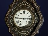 a clock with roman numerals on the face of it