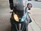 a motorcycle that is parked on the side of the street