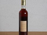 a bottle of liquor sitting on a table
