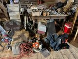 a room with a lot of clutter and tools on the floor