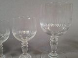 three empty wine glasses sitting on a table next to each other