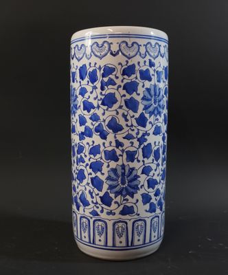 blue and white porcelain vase with floral design on a black background