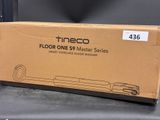 the box is empty on the table next to the floor