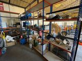 many shelves with various items in them in a warehouse