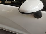 an image of a side view mirror on a white car