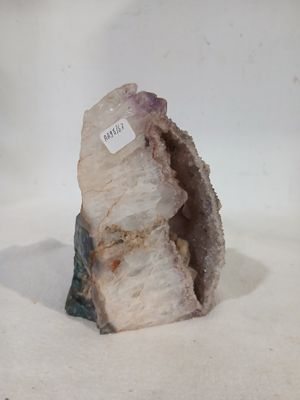 a piece of rock with a tag on it