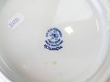 a white plate with a blue and white design on it