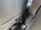 a seat belt that is attached to the back of a car